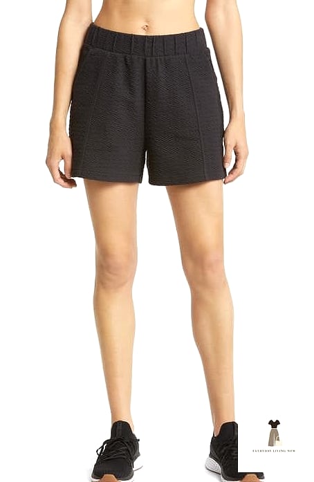 30 Black Shorts Outfit Every Woman Needs to See 12 Athletic Black Shorts With an Oversized Graphic Tee