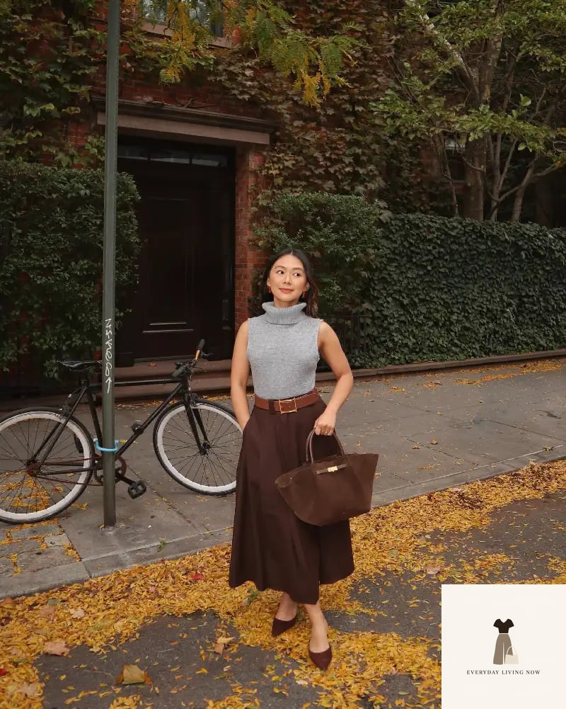 Sleeveless Gray Turtleneck Knit with High-Waisted Chocolate Midi Skirt and Wide Leather Belt