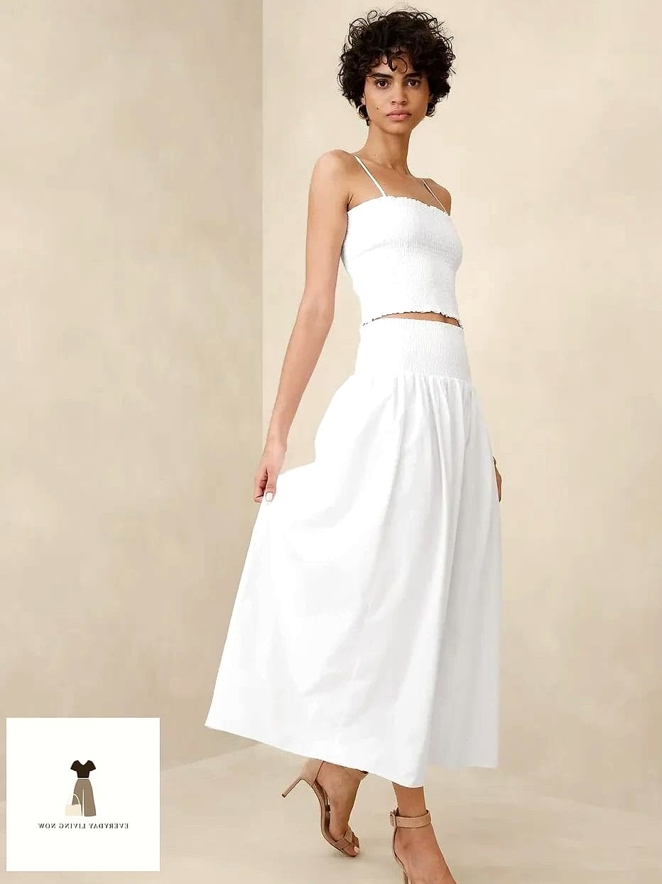 27 White Outfit That Are Breathtakingly Beautiful 15 White Midi Skirt with a Cropped Sweater