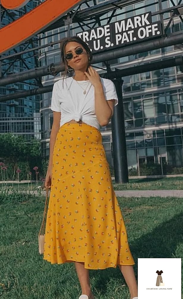 27 Yellow Outfit Every Style Lover Needs to See 11 Yellow Midi Skirt With a Tucked-In Blouse