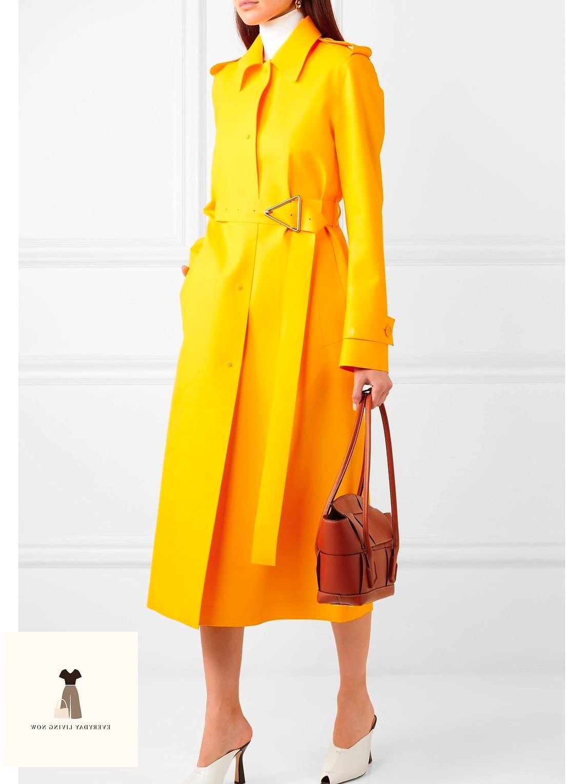 27 Yellow Outfit Every Style Lover Needs to See 14 Yellow Trench Coat Over an All-Black Outfit